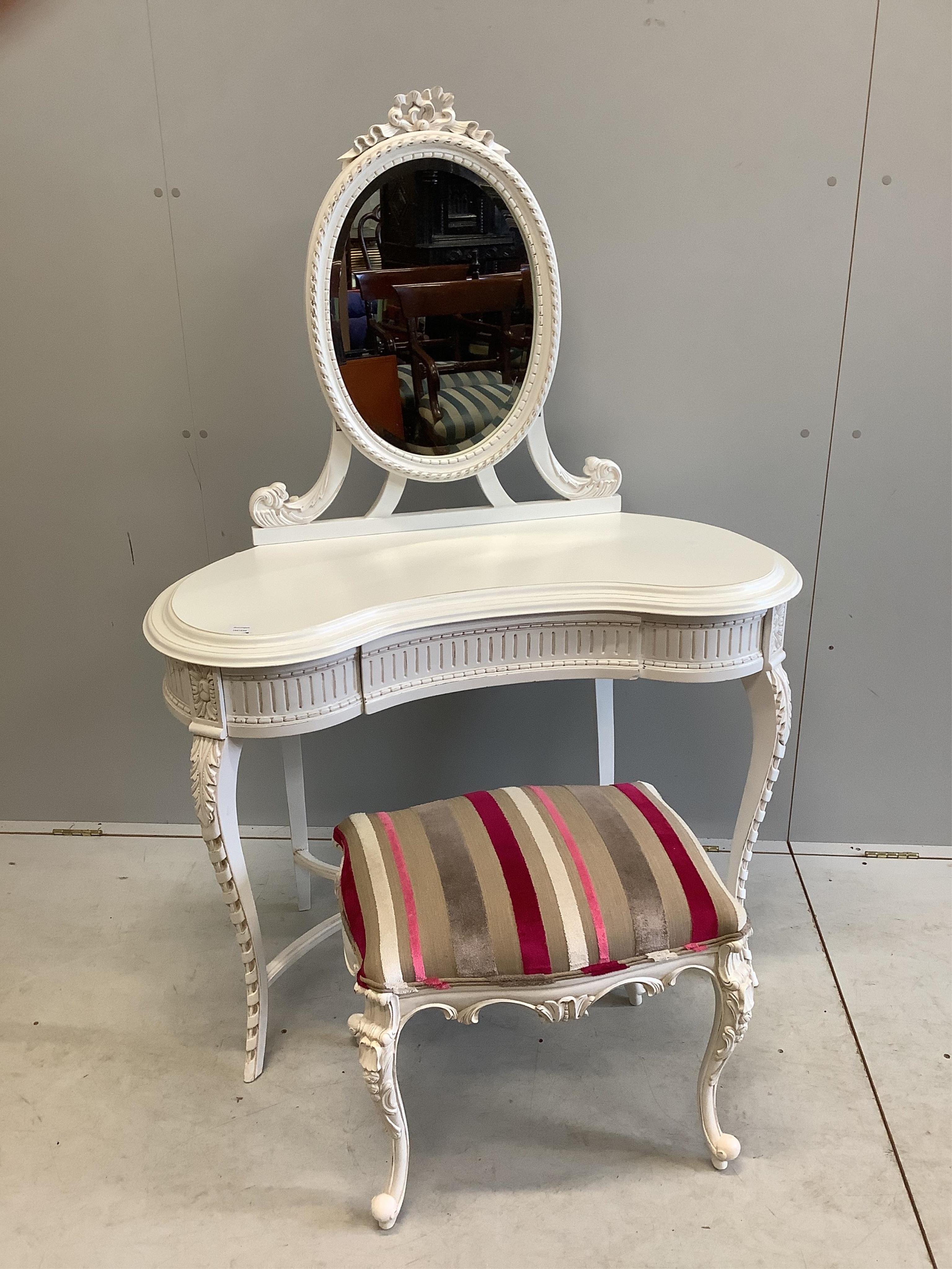 A modern Victorian style white painted kidney shaped dressing table, width 104cm, depth 48cm, height 146cm and a stool. Condition - good